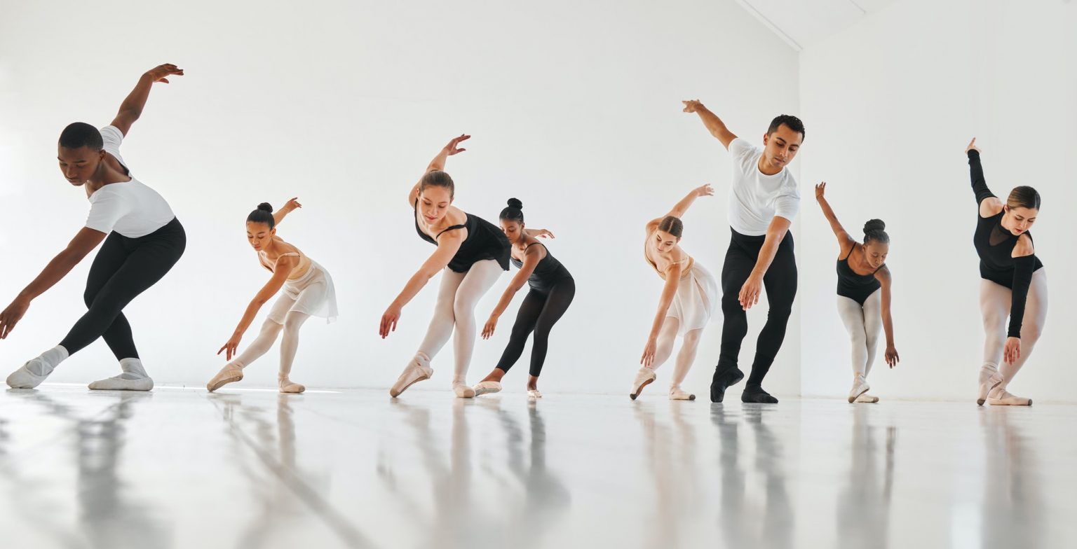 Shot of a group of young ballet dancers practicing their routine in a dance studio